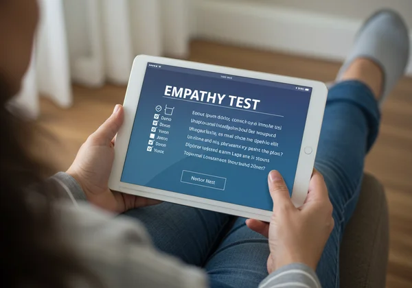 Person taking an empathy test on a digital device.